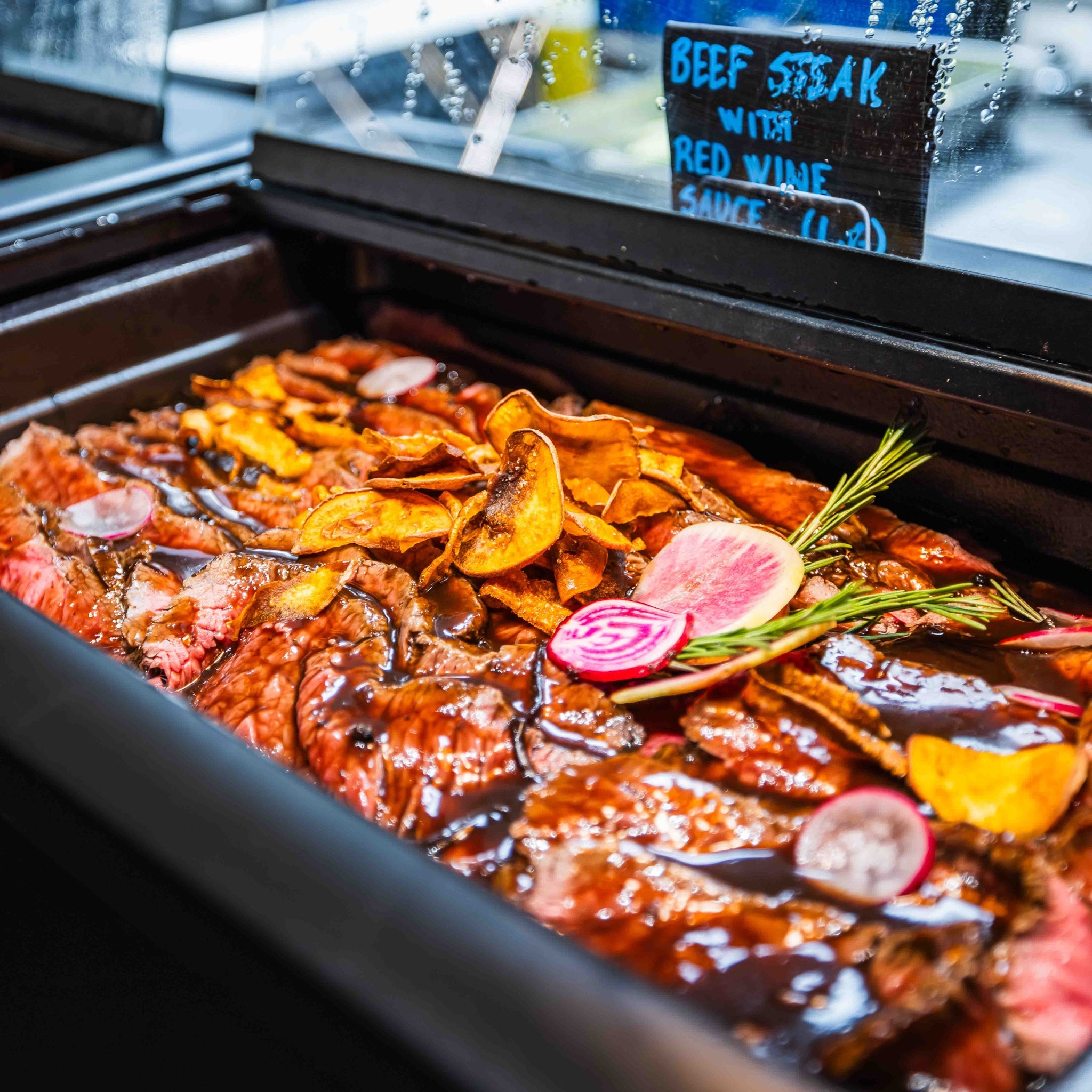 Close-up of beef steak with red wine sauce at Santa's Cuisine Restaurant by Santa Claus Holiday Village