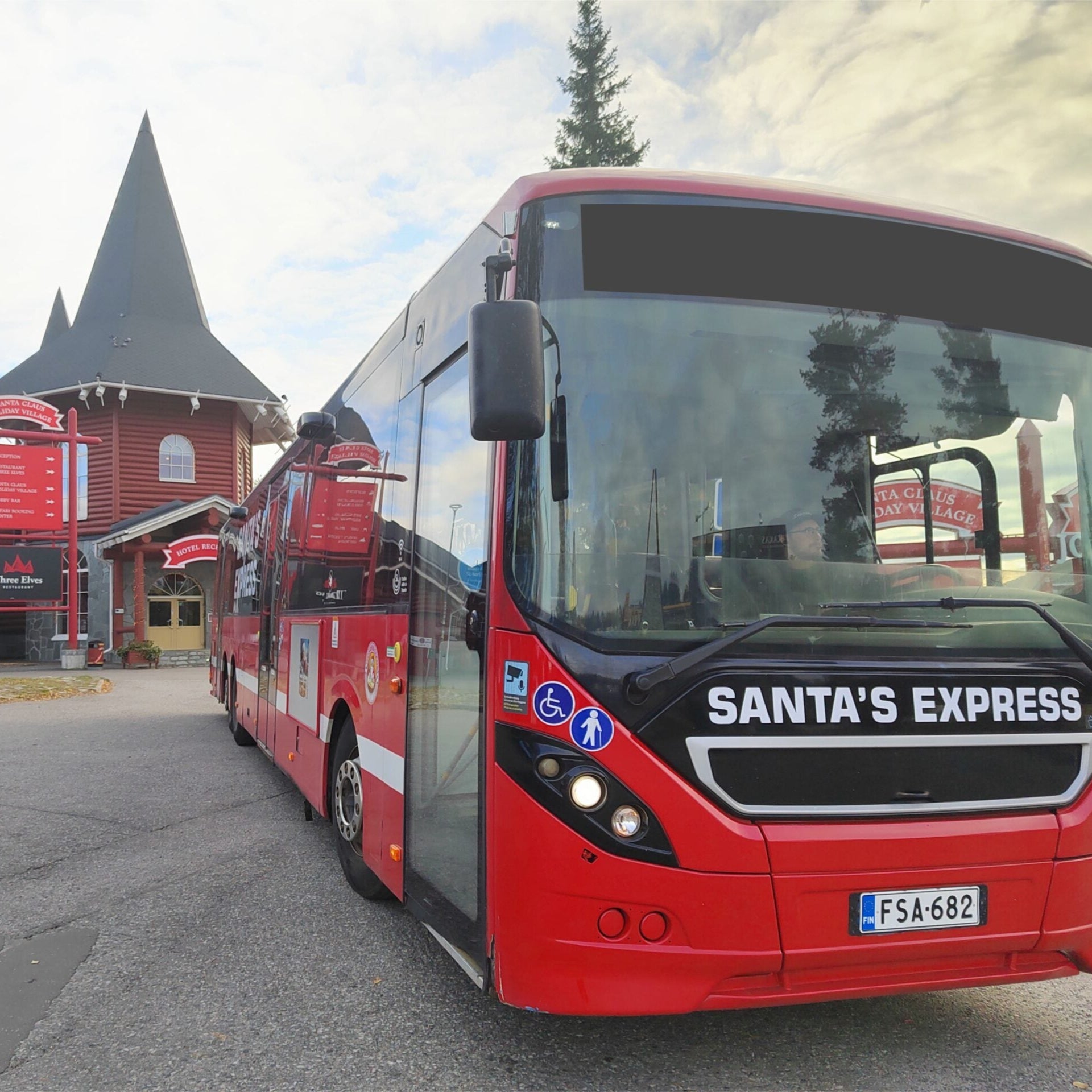 Red Santa’s Express bus ready for departure to Santa Claus Village, Airport Express Rovaniemi