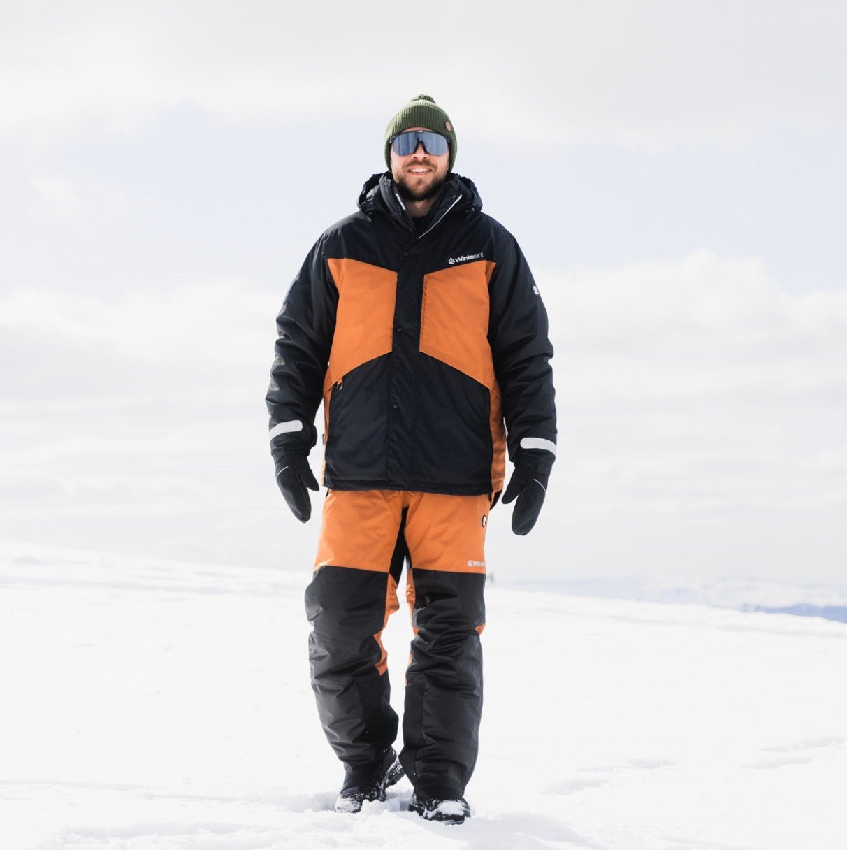 Man wearing Winter Clothing Set Rovaniemi in snowy landscape by WinterRent