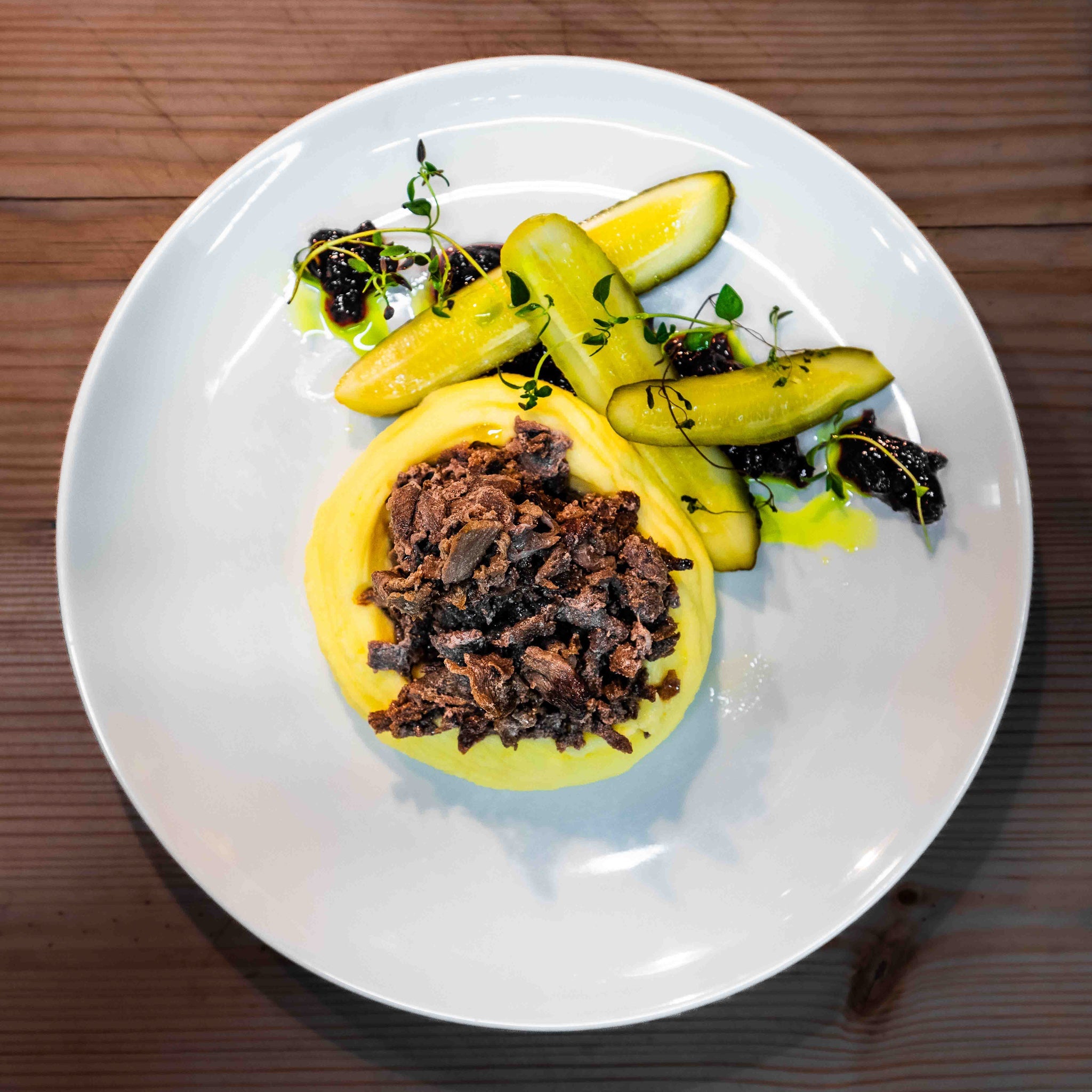 Gourmet dish served at Three Elves Restaurant on a white plate, Santa Claus Holiday Village.