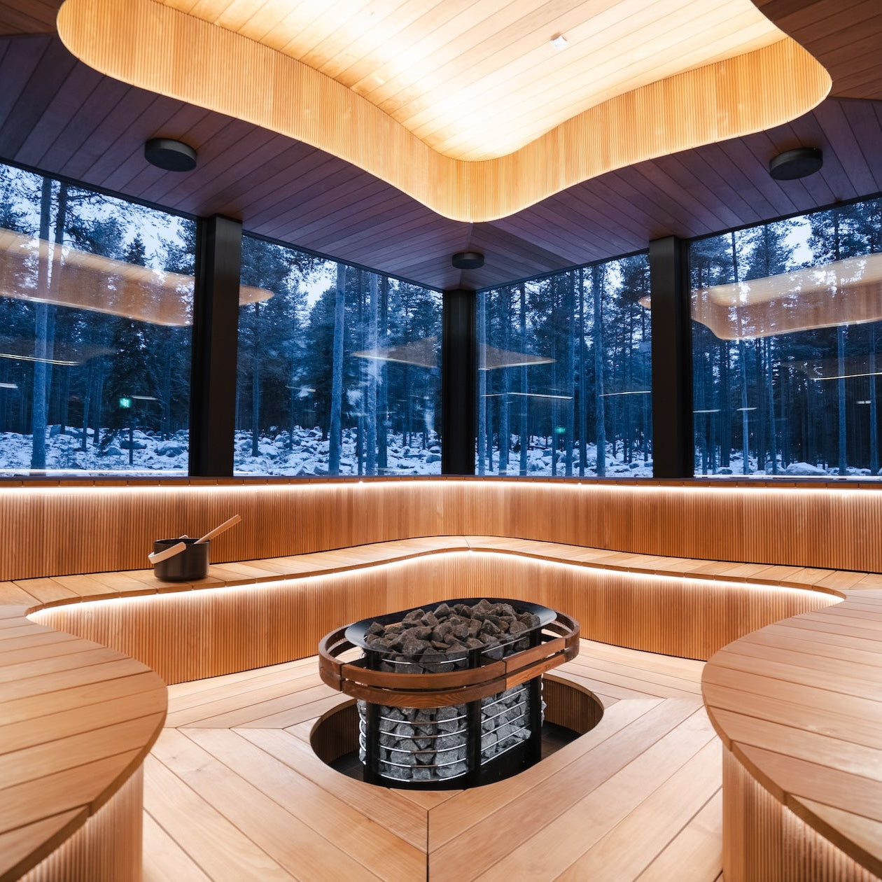Interior of the Wave group sauna with panoramic views for Arctic spa experience with bathrobe dinner by Invisible forest lodge