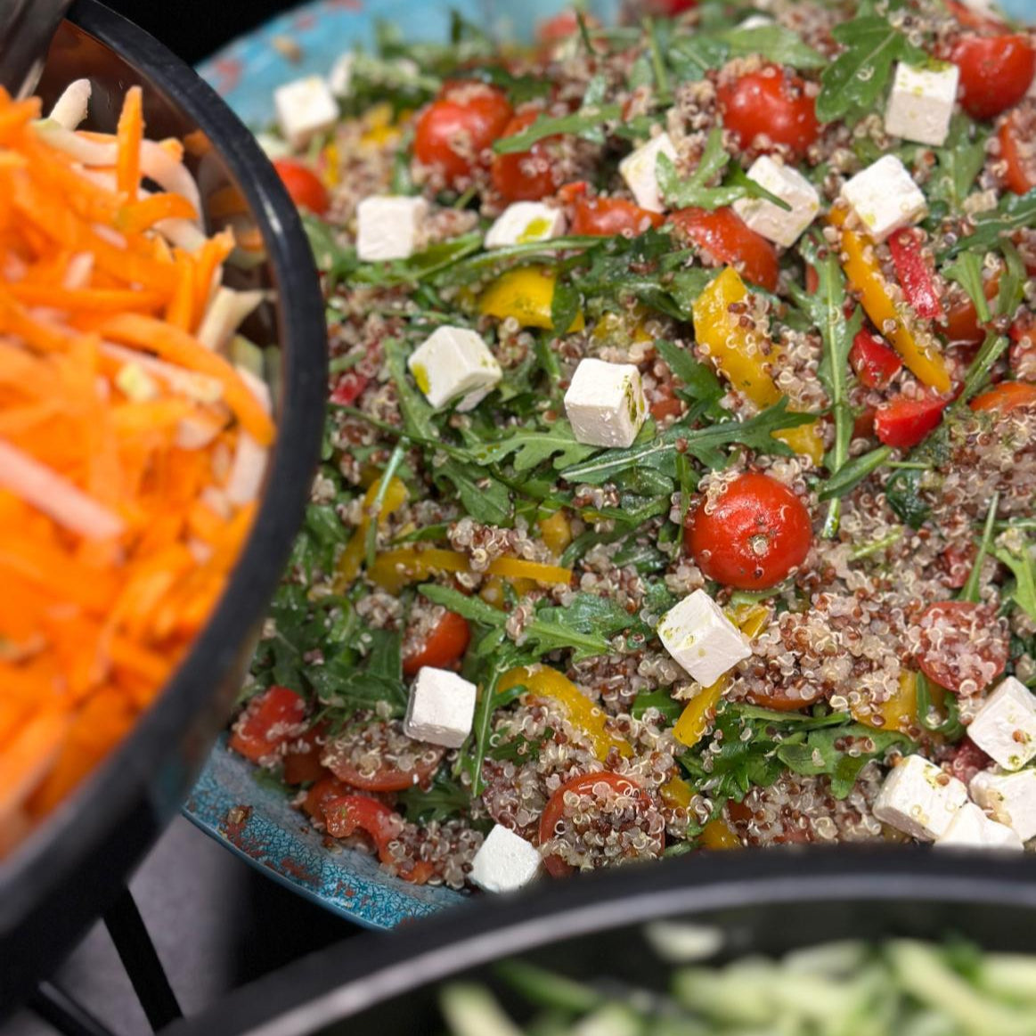 Close-up of fresh quinoa salad with cherry tomatoes and feta cubes from Feenix Restaurant Minimani by Ravintola Feenix