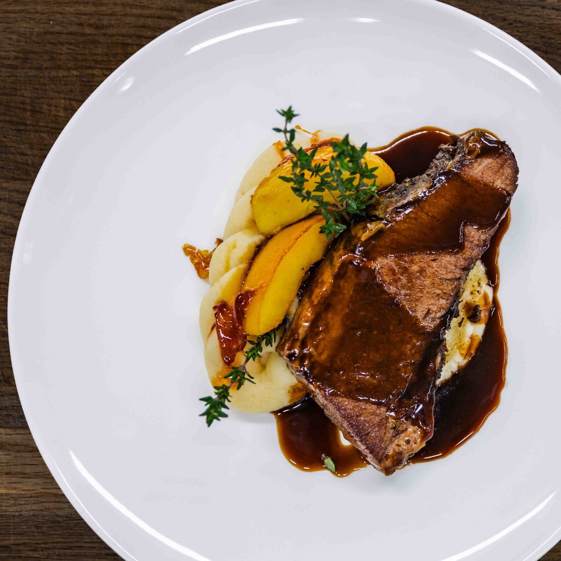 Christmas House Restaurant gourmet steak with mashed potatoes and herbs served at Santa Claus Holiday Village