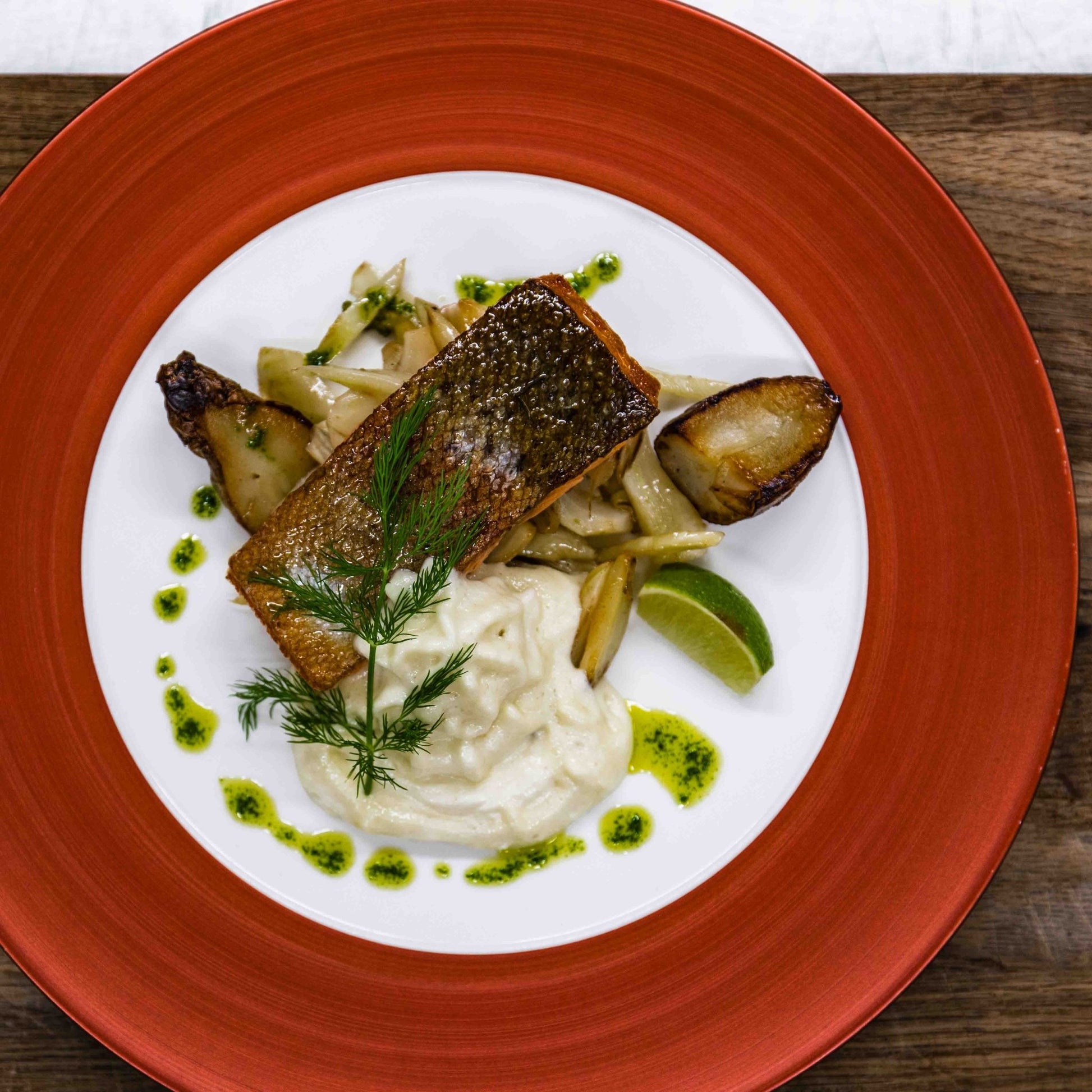Grilled fish with mashed potatoes and vegetables served at Christmas House Restaurant by Santa Claus Holiday Village