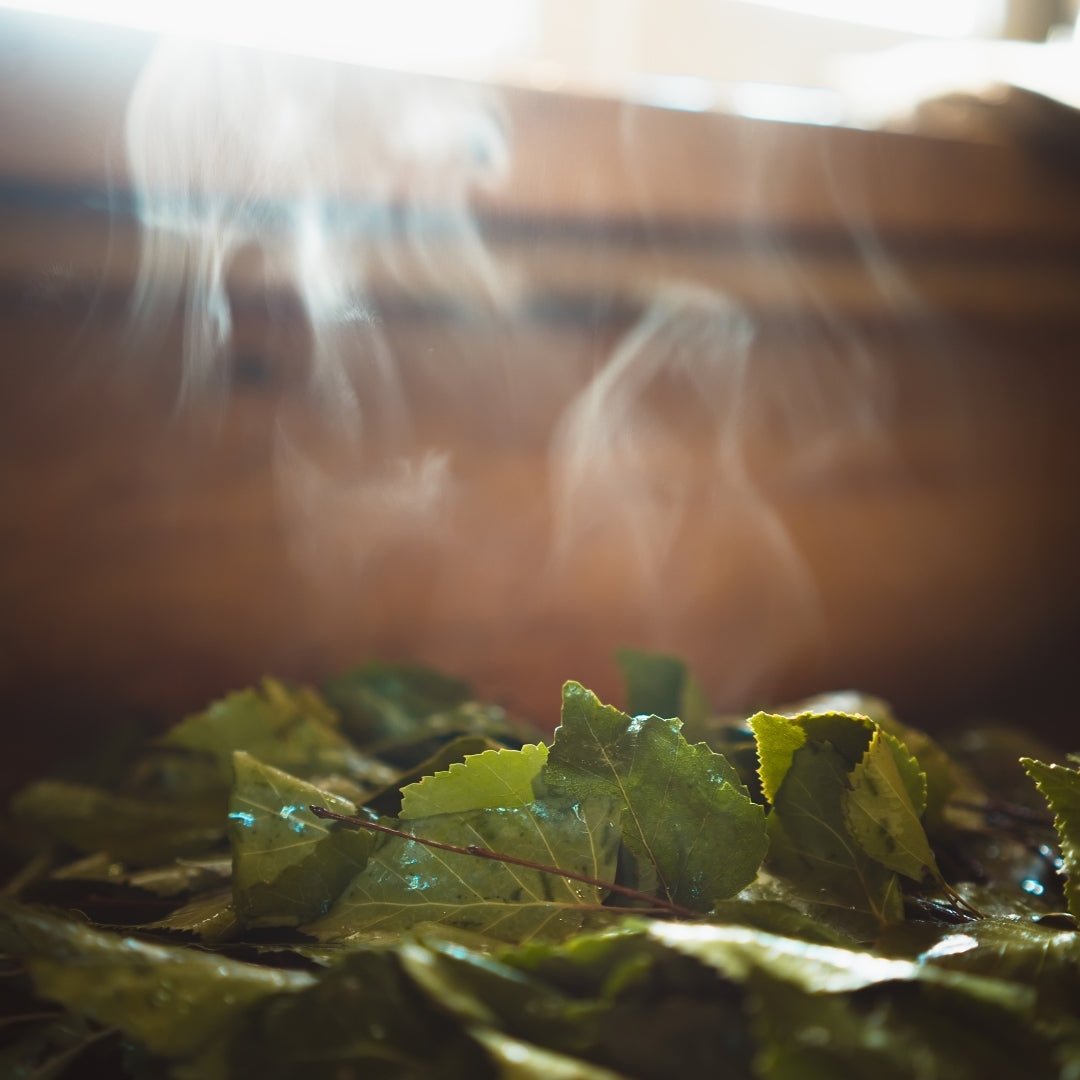 Steaming sauna leaves inside a traditional Finnish log sauna for Experience summer finnish sauna and lake by Lapin Väki