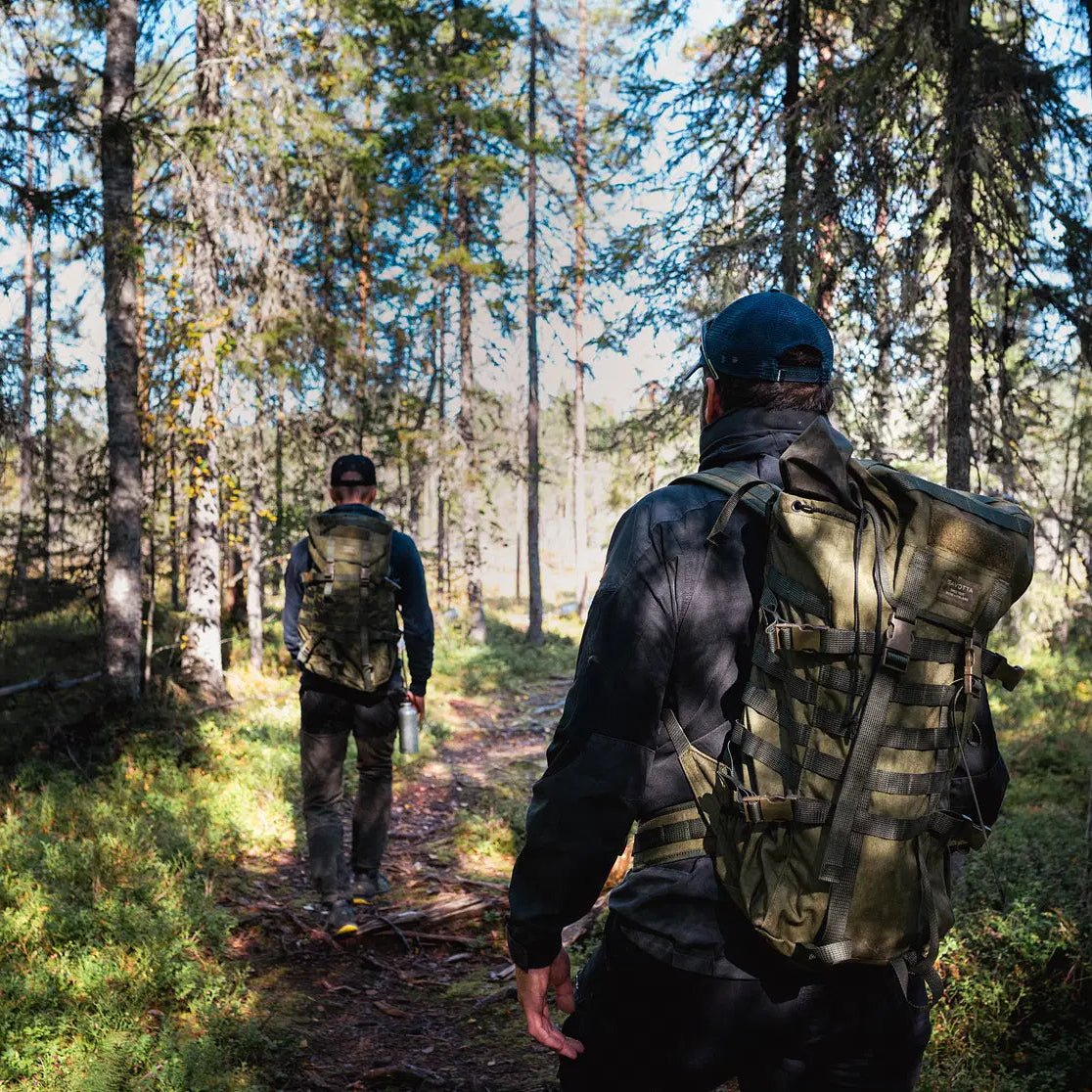 Two hikers exploring the Magical Forest Hiking Adventure in Finnish forest, Pure Lapland