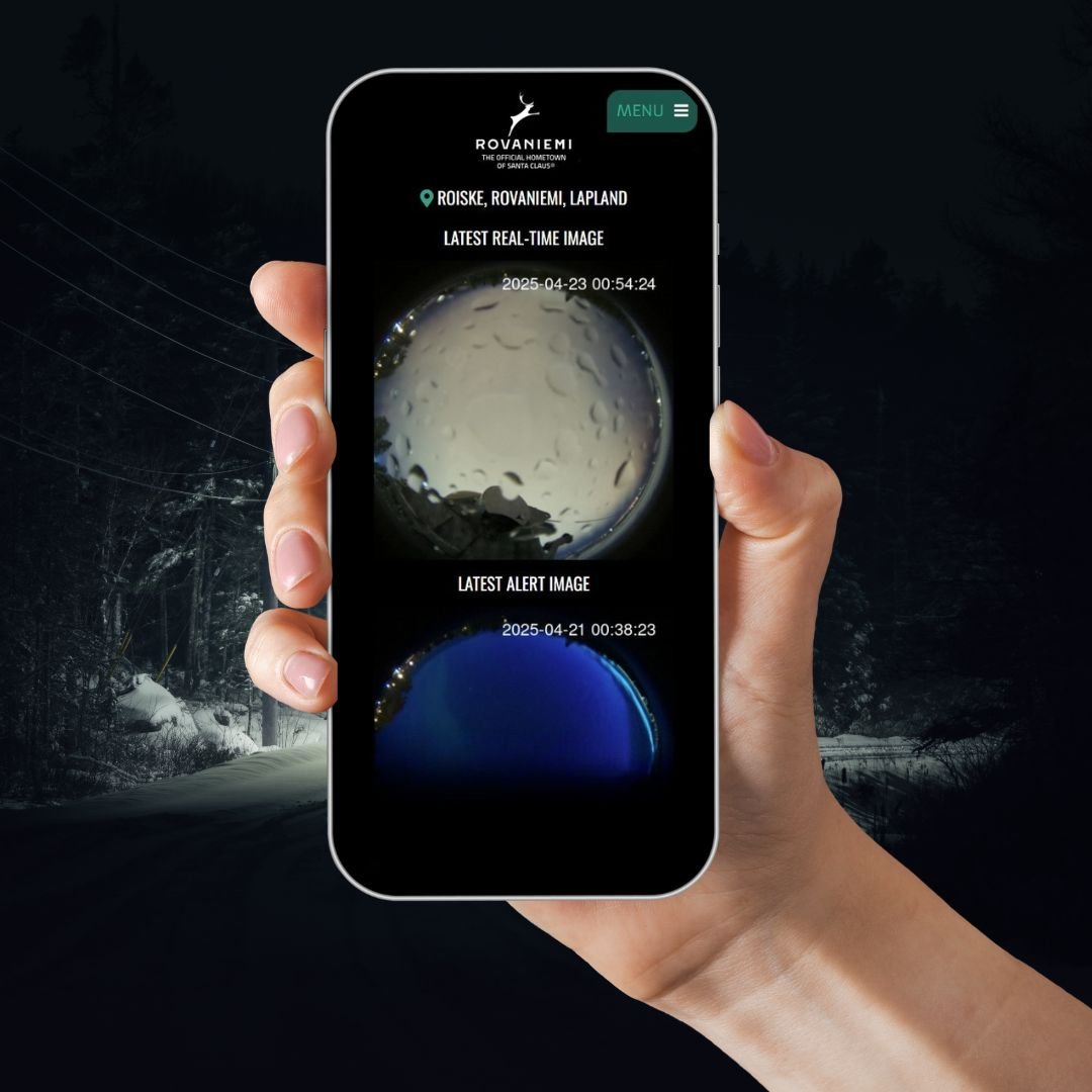 Hand holding phone showing real-time aurora images for Northern Lights Alert App Rovaniemi by Northern Lights Alert