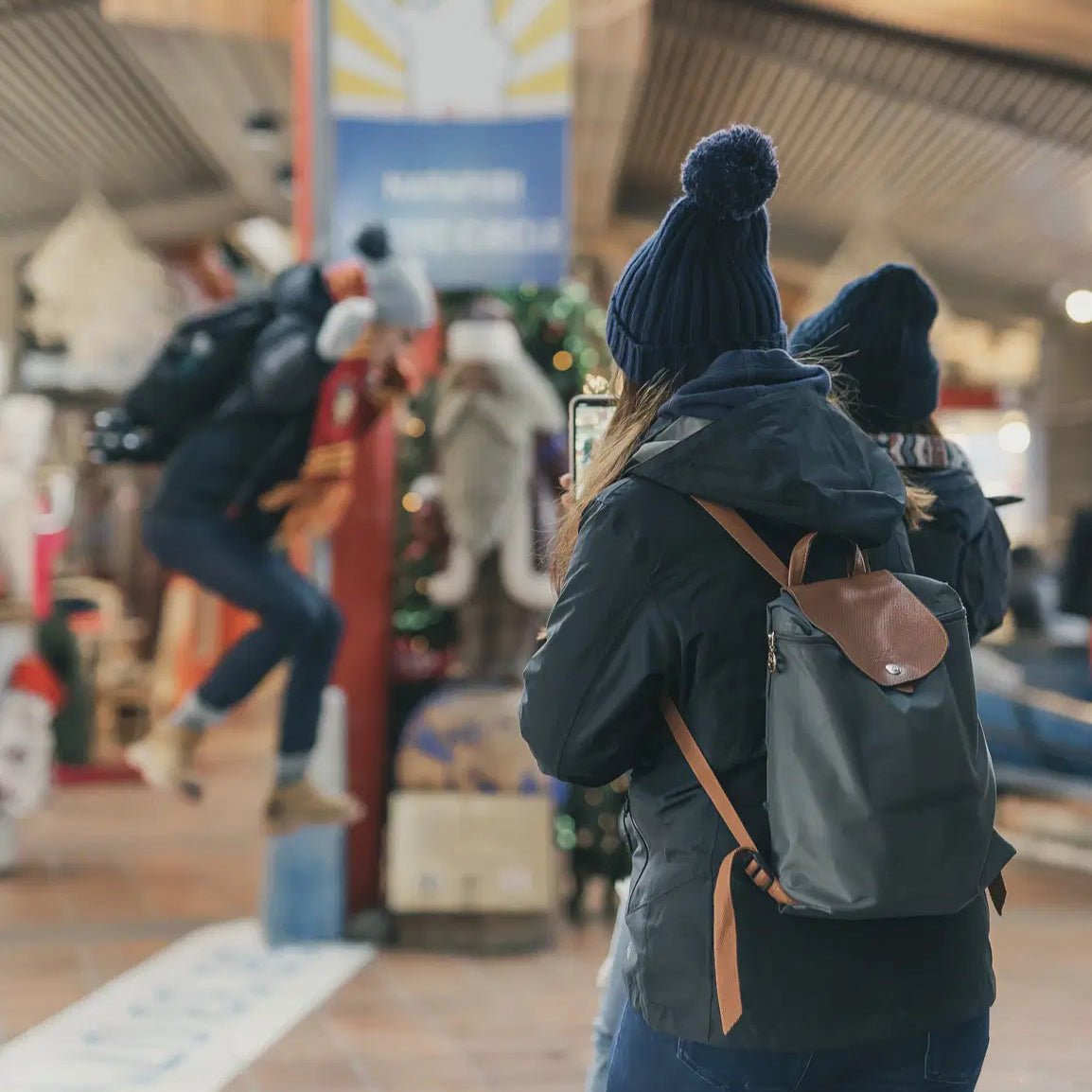 Tourists capturing festive moments during Photoshoot in Santa Claus Village by Beyond Arctic.