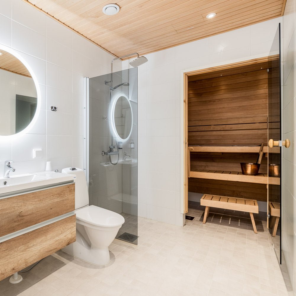 Modern bathroom with shower and wooden sauna in Santa Claus Holiday Village apartment, Santa Claus Holiday Village.