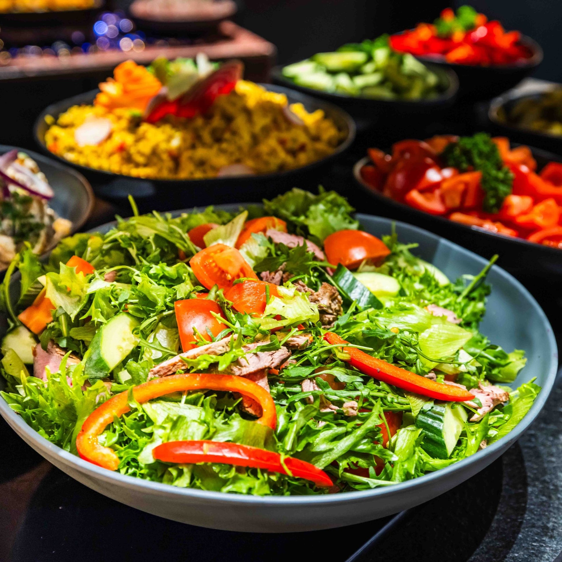 Fresh salad bowl with vibrant vegetables served at Santa's Cuisine Restaurant by Santa Claus Holiday Village