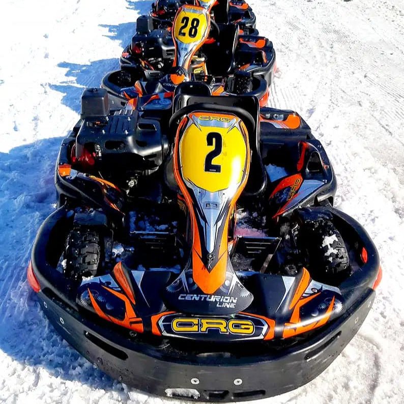 Santa´s Ice Karting start 12.00 featuring snow racing karts lined up on icy track Santa's motor park