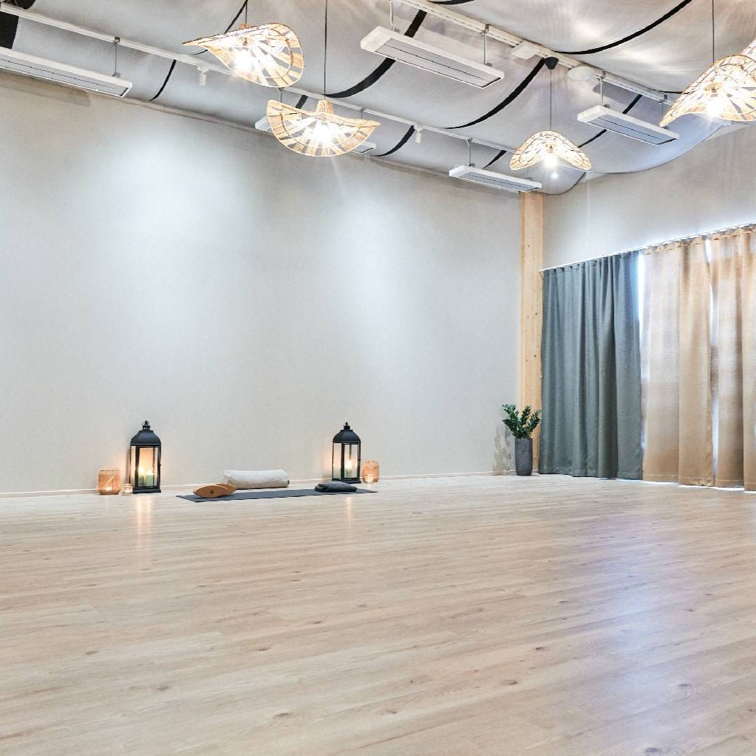 YogaClass studio with soft lighting, candles, and calm setting for relaxation and flow by Lapin Väki.