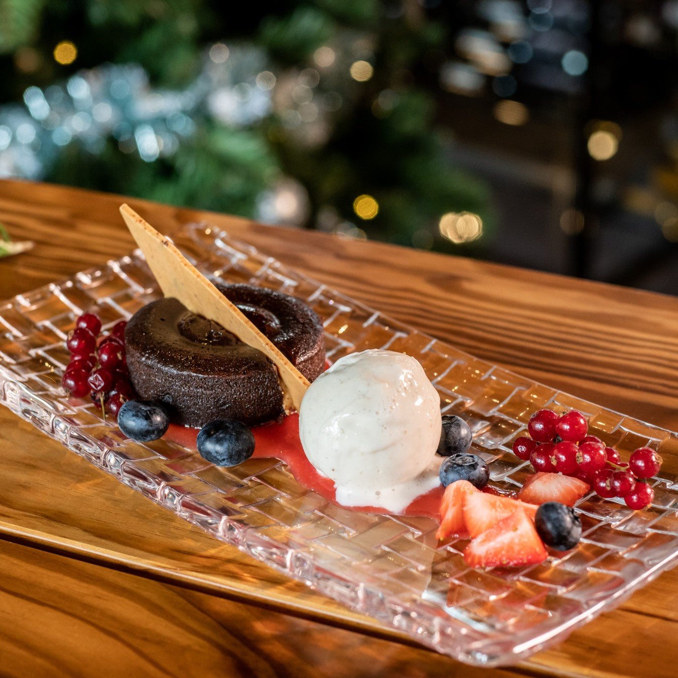Chocolate dessert with ice cream and fresh berries served at Three Elves Restaurant by Santa Claus Holiday Village